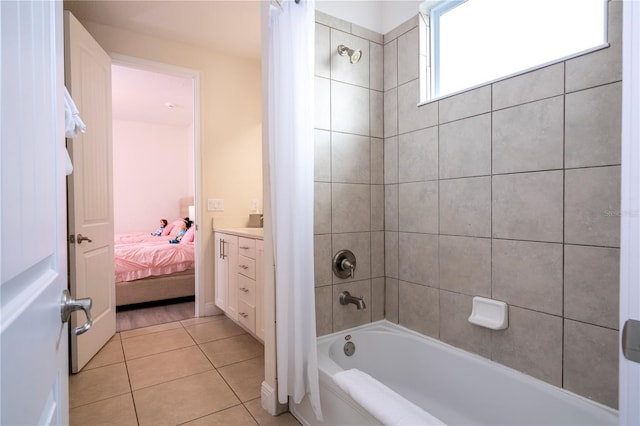 bathroom featuring vanity, tile patterned flooring, and shower / bath combo with shower curtain