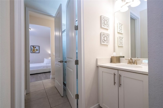 bathroom featuring vanity and tile patterned flooring