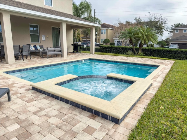 view of swimming pool featuring a grill, an outdoor living space, a patio area, and an in ground hot tub