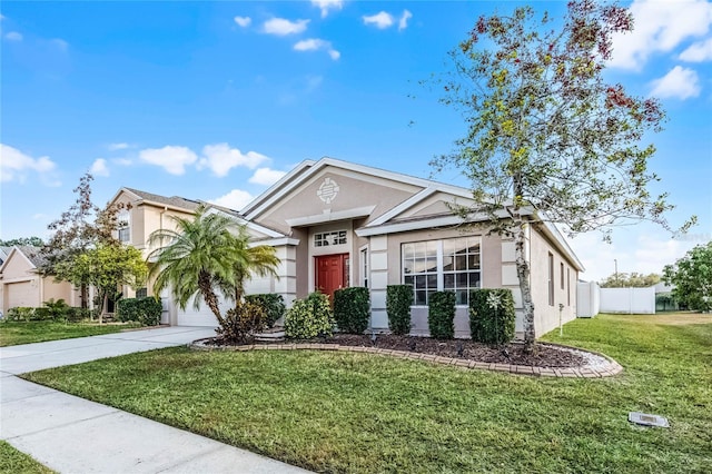 view of front of home featuring a garage and a front lawn