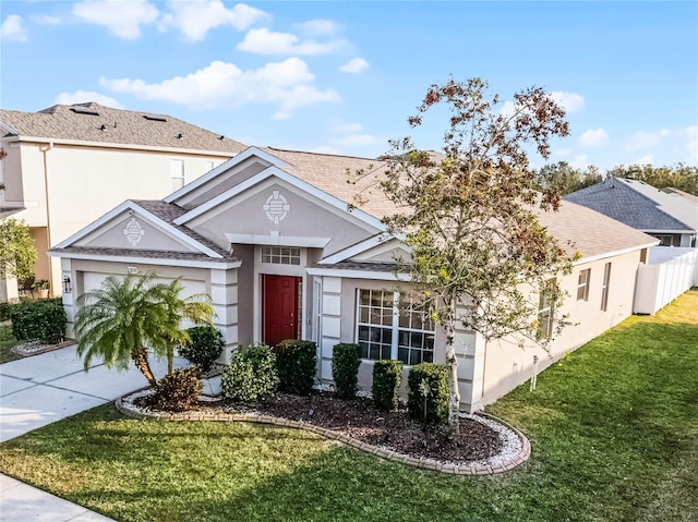 view of front of property with a garage and a front yard