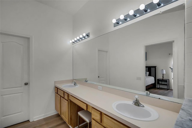 bathroom with vanity and hardwood / wood-style flooring