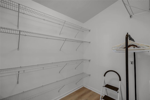 walk in closet featuring light hardwood / wood-style flooring