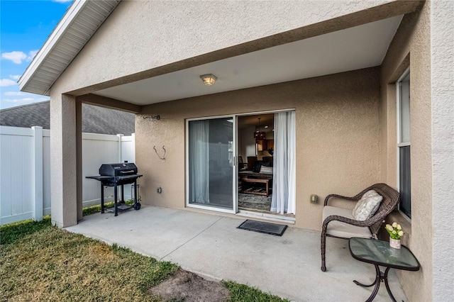 view of patio featuring a grill