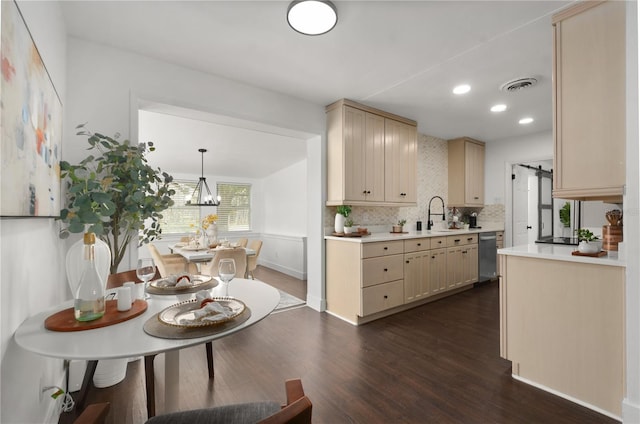 kitchen with visible vents, decorative backsplash, dark wood-style flooring, decorative light fixtures, and light countertops