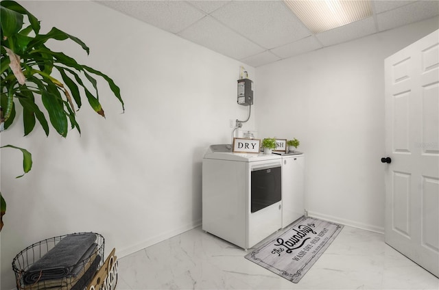 clothes washing area featuring marble finish floor, baseboards, laundry area, and washer and dryer