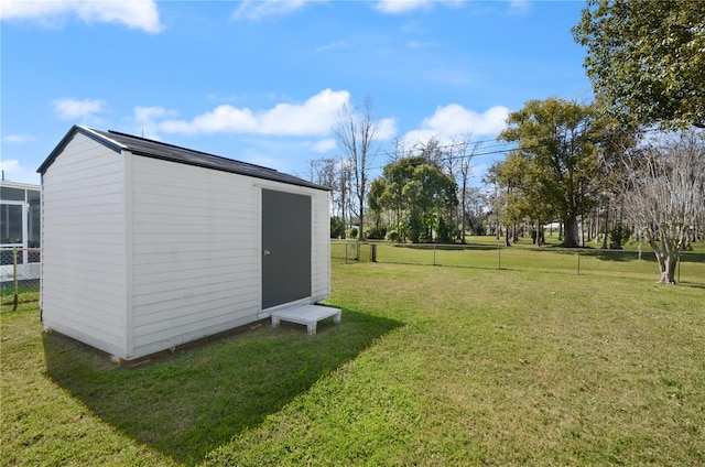 view of shed with fence