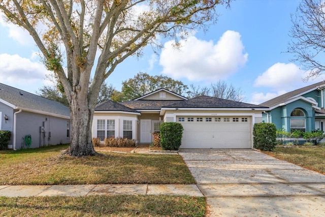 ranch-style home featuring a garage and a front yard