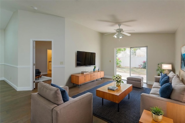 living room featuring lofted ceiling, dark hardwood / wood-style floors, and ceiling fan