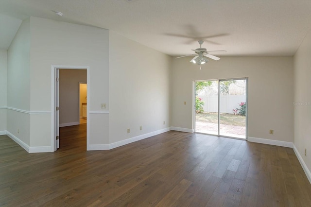 unfurnished room with ceiling fan, lofted ceiling, and dark hardwood / wood-style flooring