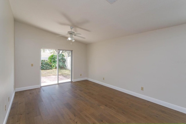 empty room featuring ceiling fan, lofted ceiling, and dark hardwood / wood-style flooring