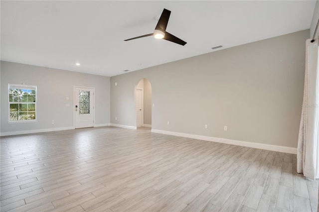 spare room featuring ceiling fan and light wood-type flooring