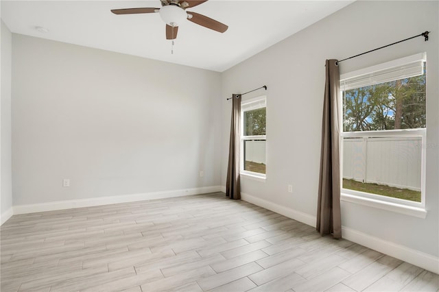 unfurnished room featuring light hardwood / wood-style flooring and ceiling fan