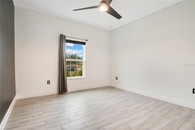 empty room with light hardwood / wood-style floors and ceiling fan