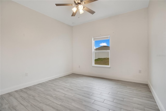 spare room with ceiling fan and light hardwood / wood-style flooring