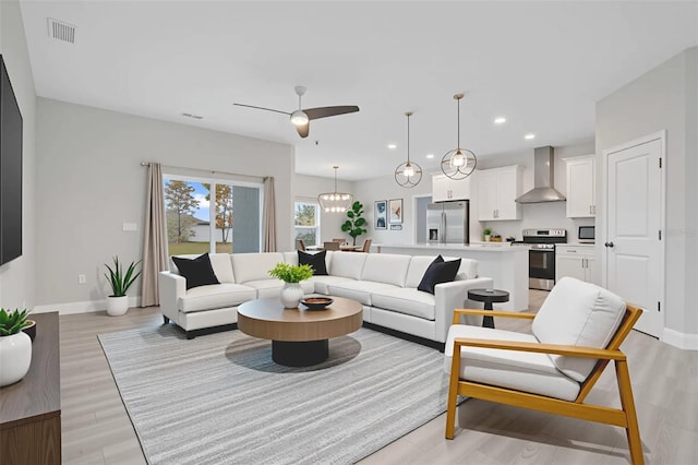 2011 Begonia Way, Poinciana, FL 34759 - living room featuring baseboards, light wood-style flooring, recessed lighting, and ceiling fan