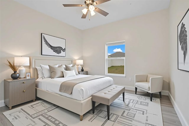 2011 Begonia Way, Poinciana, FL 34759 - bedroom featuring light wood finished floors, baseboards, and a ceiling fan