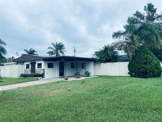 ranch-style home with a front yard