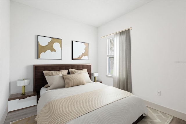 bedroom with hardwood / wood-style floors