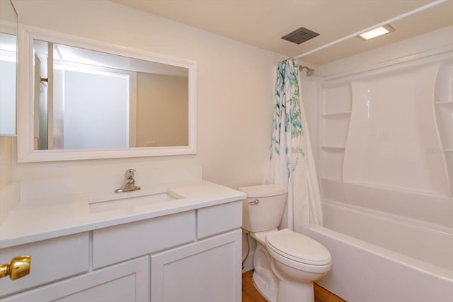 full bathroom with shower / tub combo, vanity, and toilet