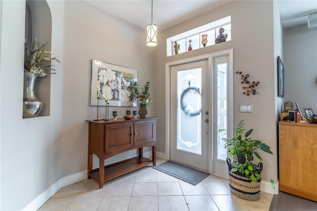 tiled entryway with a wealth of natural light