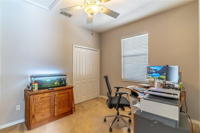 home office with light carpet and ceiling fan