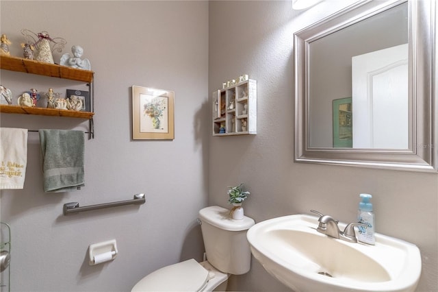 bathroom featuring sink and toilet