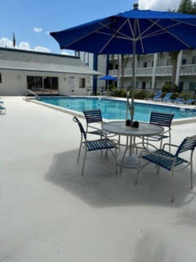 view of swimming pool featuring a patio area