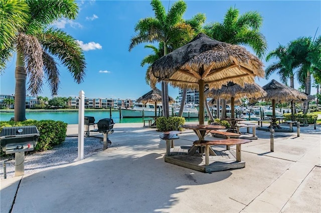 surrounding community with a gazebo and a water view