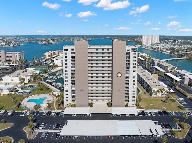 birds eye view of property with a water view and a city view