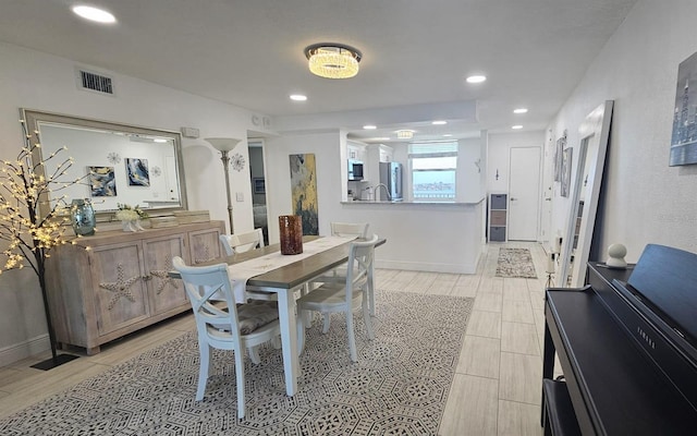 dining space with recessed lighting, baseboards, and visible vents