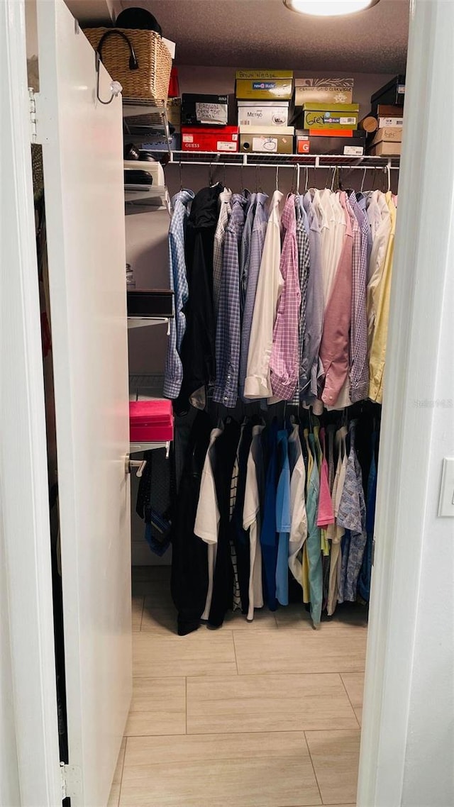 spacious closet with wood finished floors