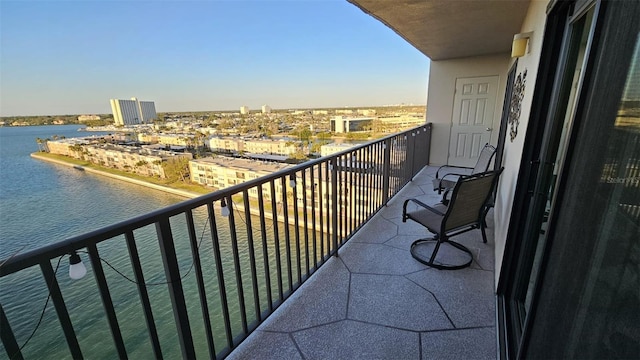 balcony with a city view and a water view