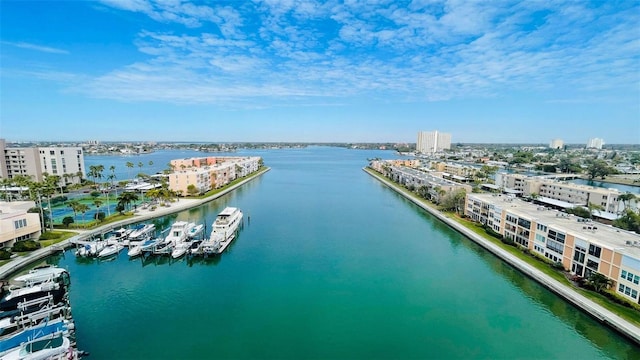 birds eye view of property with a water view and a view of city