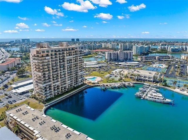 birds eye view of property with a city view and a water view