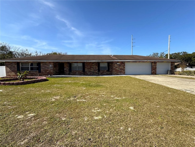 single story home featuring a garage and a front lawn