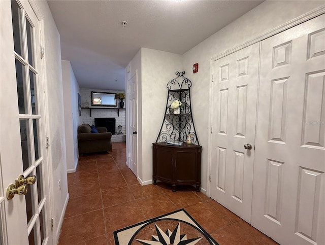 hallway featuring tile patterned floors