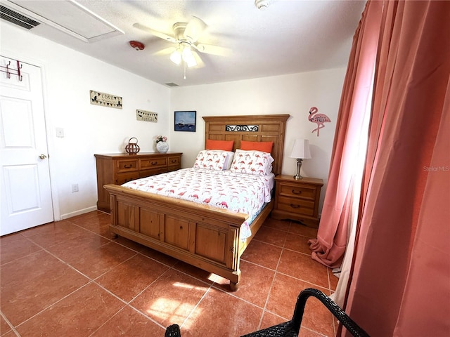 bedroom featuring ceiling fan and dark tile patterned flooring