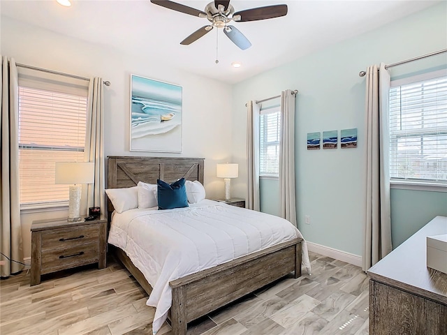 bedroom featuring ceiling fan and light wood-type flooring