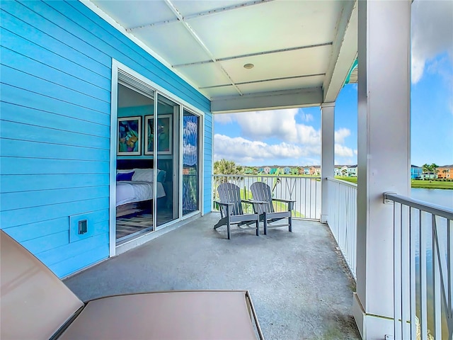 balcony featuring a water view