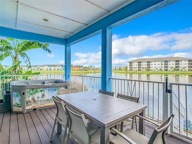 wooden deck with a water view