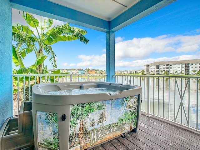 wooden deck featuring a water view