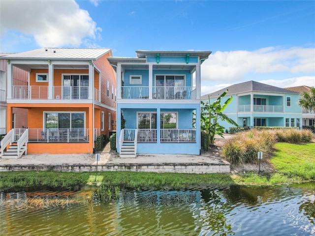 rear view of house with a water view