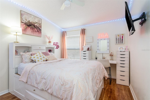 bedroom featuring dark wood-type flooring and ceiling fan