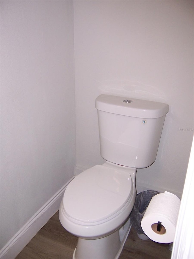 bathroom featuring toilet and hardwood / wood-style floors