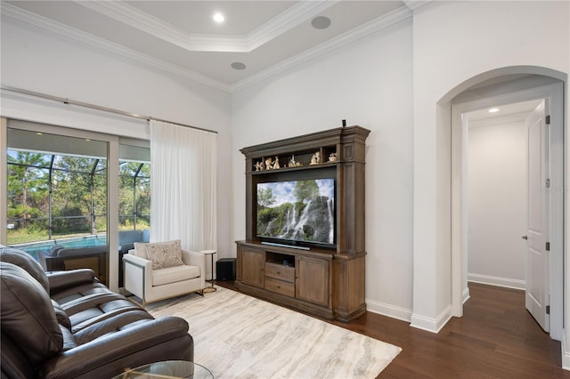 living room featuring crown molding and dark hardwood / wood-style floors