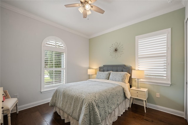 bedroom featuring dark hardwood / wood-style flooring, crown molding, and ceiling fan