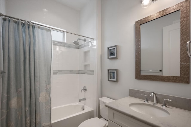 full bathroom featuring vanity, shower / bath combination with curtain, and toilet