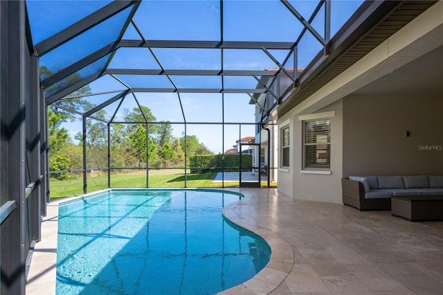 view of swimming pool featuring a patio, a lanai, and an outdoor hangout area