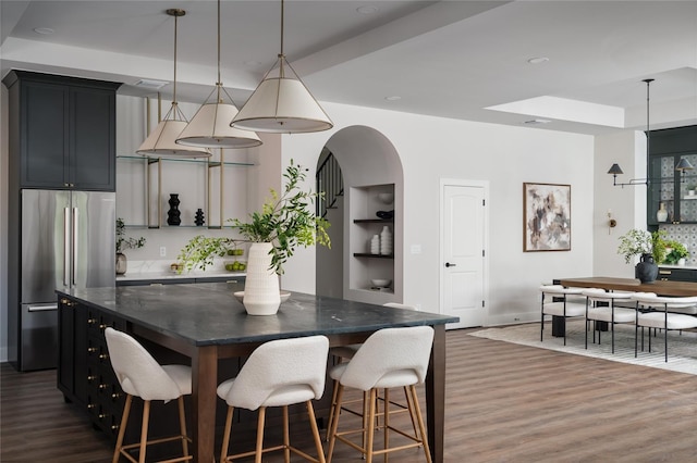 dining space with dark hardwood / wood-style flooring